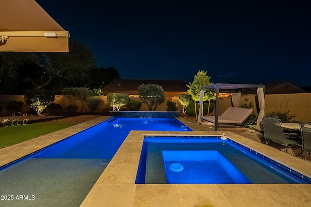 10207 W Hedge Hog Pl, Peoria, AZ 85383 - pool at twilight featuring an in-ground hot tub, a gazebo, a fenced backyard, and a patio area