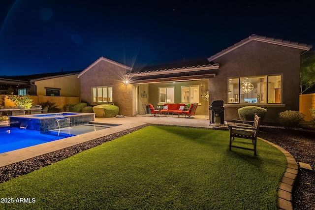10207 W Hedge Hog Pl, Peoria, AZ 85383 - back of house at twilight with a tile roof, an in-ground hot tub, a patio, stucco siding, and an outdoor hangout area