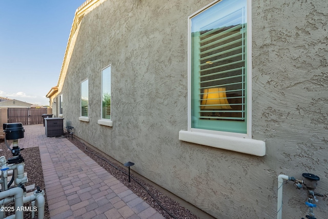 10207 W Hedge Hog Pl, Peoria, AZ 85383 - view of property exterior featuring stucco siding and a patio area