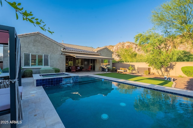 10207 W Hedge Hog Pl, Peoria, AZ 85383 - view of swimming pool with a patio area, a fenced backyard, an outdoor hangout area, and a pool with connected hot tub