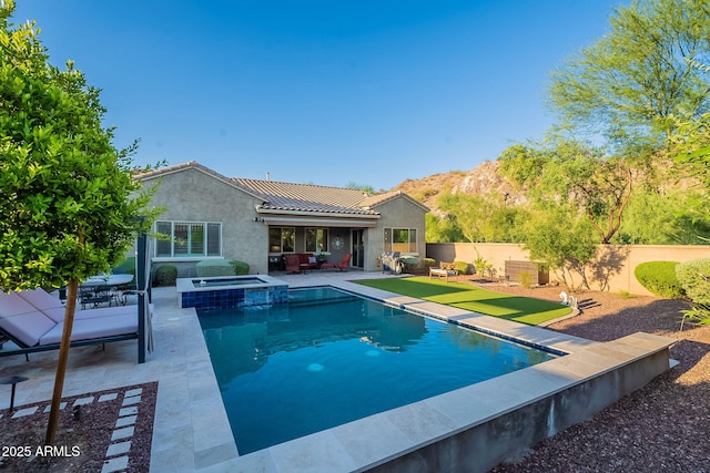 10207 W Hedge Hog Pl, Peoria, AZ 85383 - view of swimming pool featuring a patio area, a fenced backyard, and a pool with connected hot tub