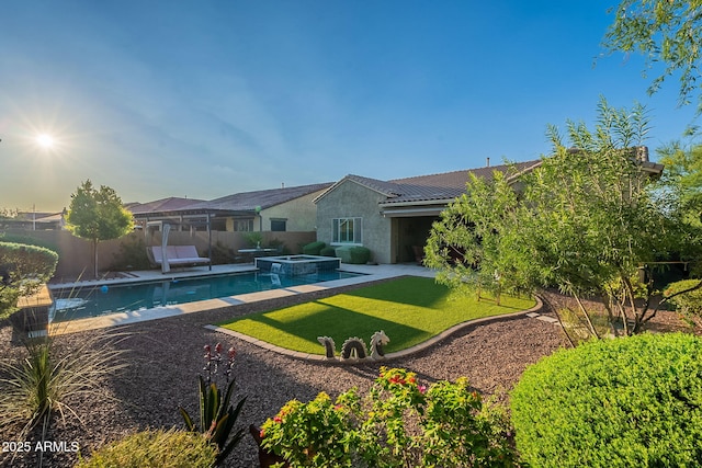 10207 W Hedge Hog Pl, Peoria, AZ 85383 - back of house featuring a patio, stucco siding, and a pool with connected hot tub