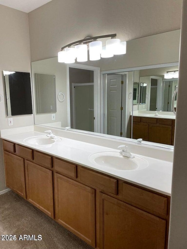 full bath featuring a sink and double vanity