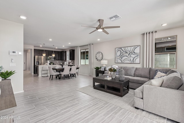 living room featuring ceiling fan