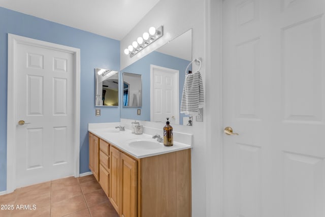 bathroom with tile patterned flooring and vanity