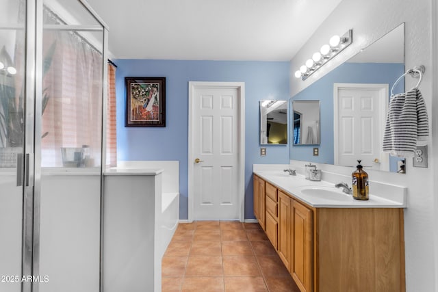 bathroom featuring vanity, plus walk in shower, and tile patterned flooring