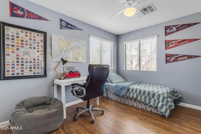 bedroom with wood-type flooring and ceiling fan