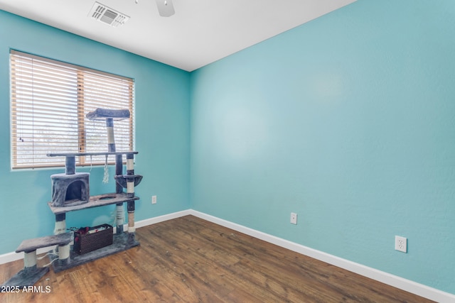 interior space featuring hardwood / wood-style floors and ceiling fan