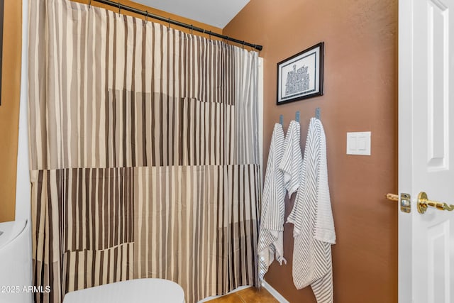 bathroom with tile patterned floors and toilet