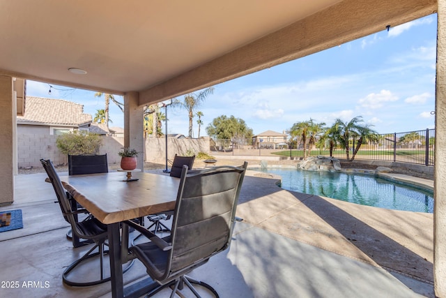 view of patio featuring a fenced in pool