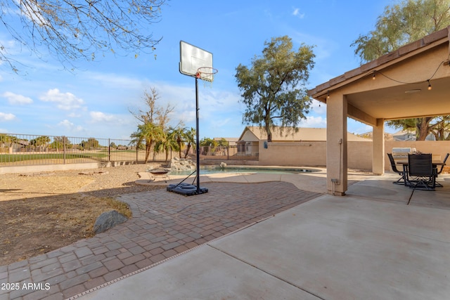 view of patio / terrace with a fenced in pool