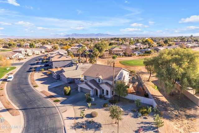 birds eye view of property with a mountain view