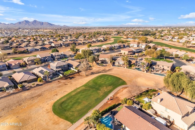 birds eye view of property with a mountain view