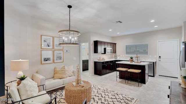 24052 W Pima St, Buckeye, AZ 85326 - living room featuring a chandelier and recessed lighting
