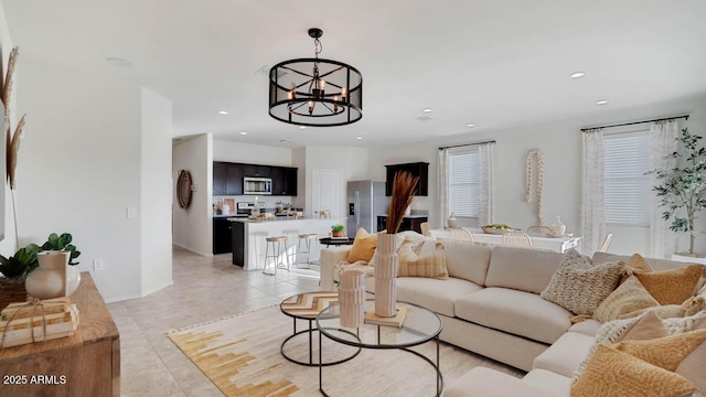 24052 W Pima St, Buckeye, AZ 85326 - living room with recessed lighting, a chandelier, and light tile patterned floors