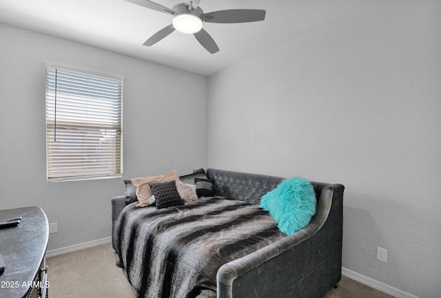 bedroom featuring baseboards, light carpet, and ceiling fan