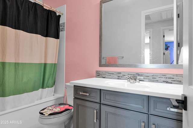 full bathroom featuring vanity, shower / tub combo, toilet, and backsplash