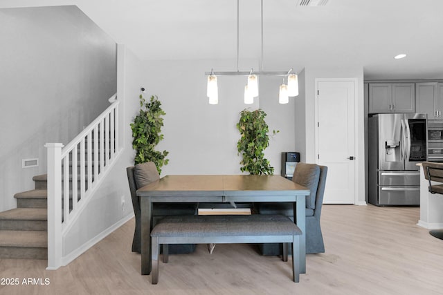 dining area featuring stairway, recessed lighting, visible vents, and light wood finished floors