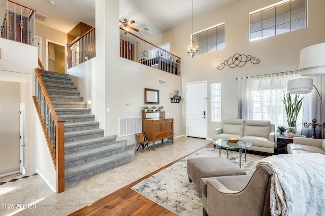 living room with light hardwood / wood-style flooring and a notable chandelier