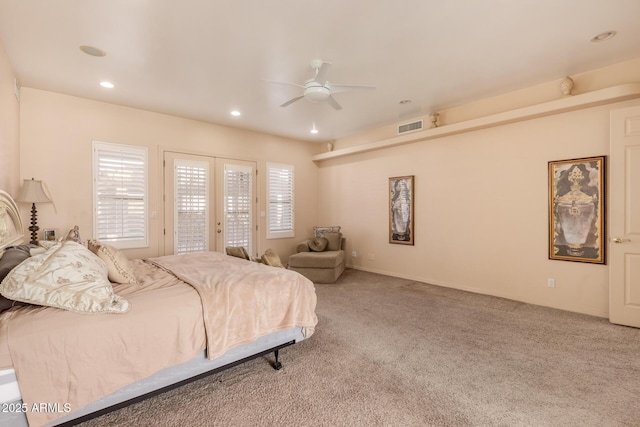 carpeted bedroom with ceiling fan and access to exterior