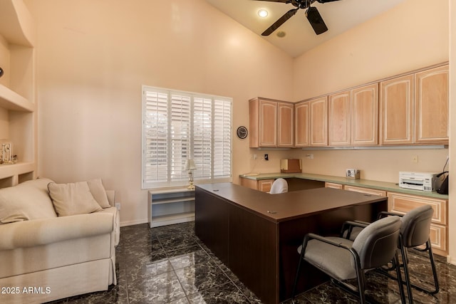 office area featuring ceiling fan and a towering ceiling