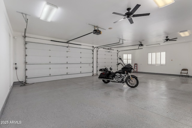 garage featuring ceiling fan and a garage door opener