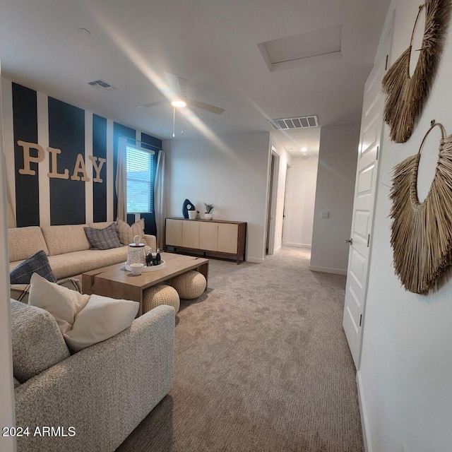 carpeted living room featuring ceiling fan