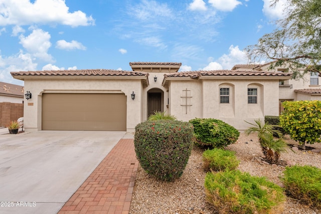 mediterranean / spanish-style home with a garage