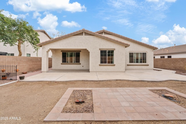 rear view of house with a patio