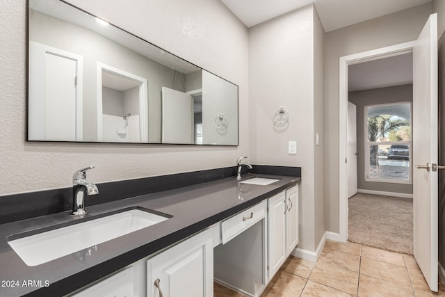 bathroom featuring tile patterned flooring and vanity