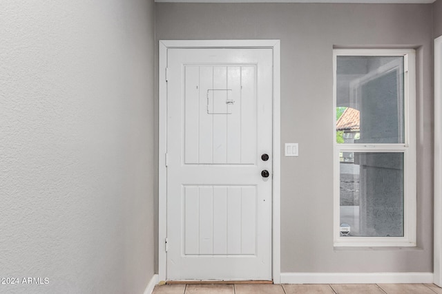 interior space with light tile patterned floors