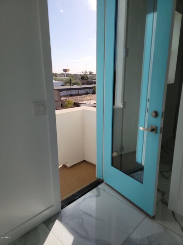 doorway featuring light tile floors