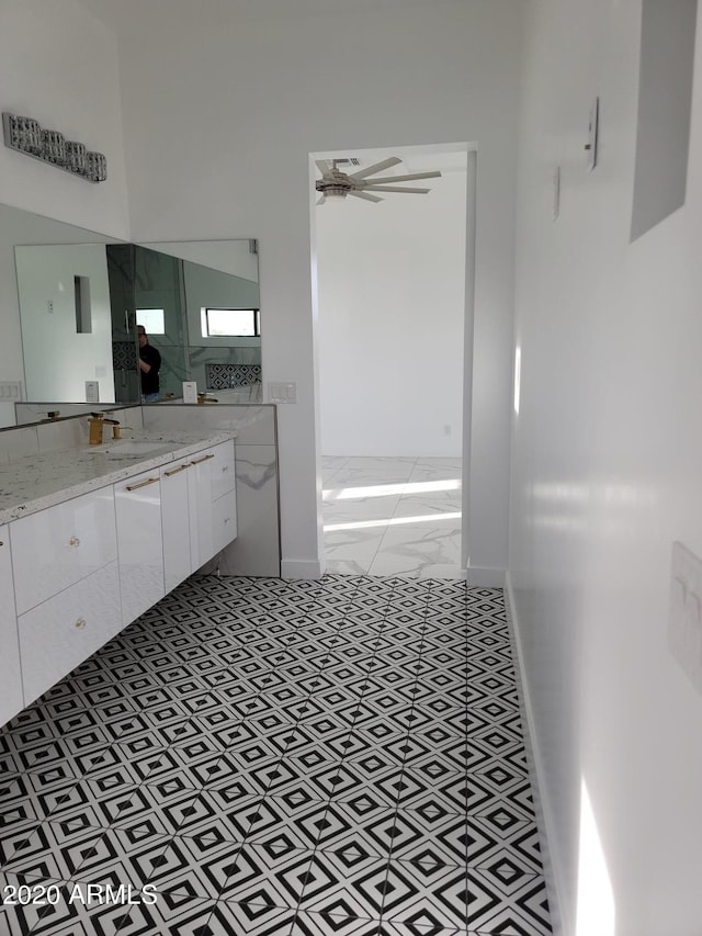 bathroom with ceiling fan, tile floors, and oversized vanity