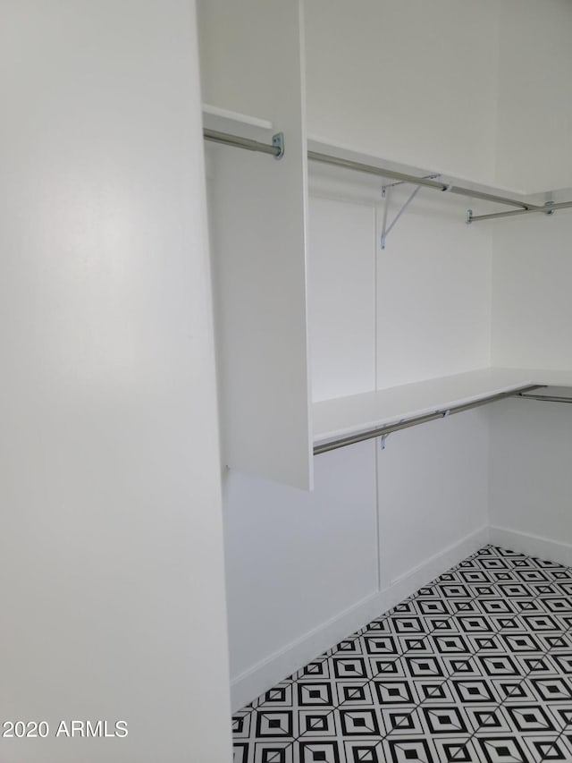 spacious closet featuring tile floors