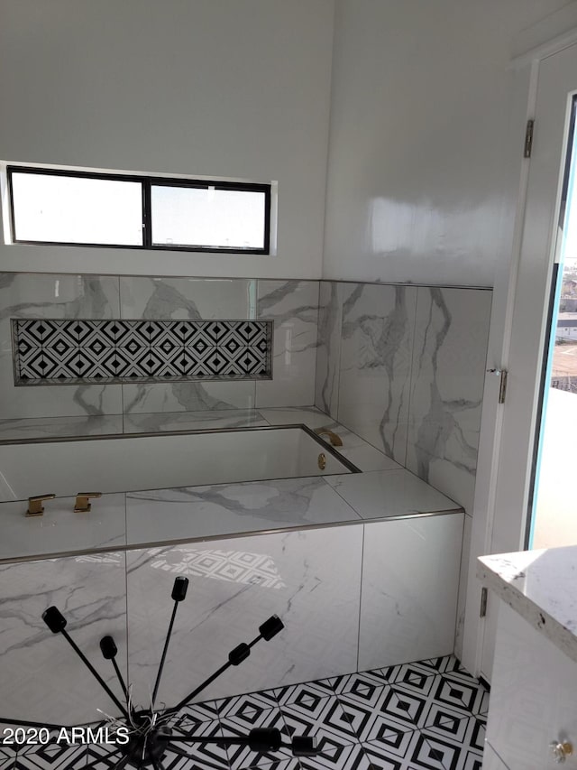 bathroom with tile walls and tile floors