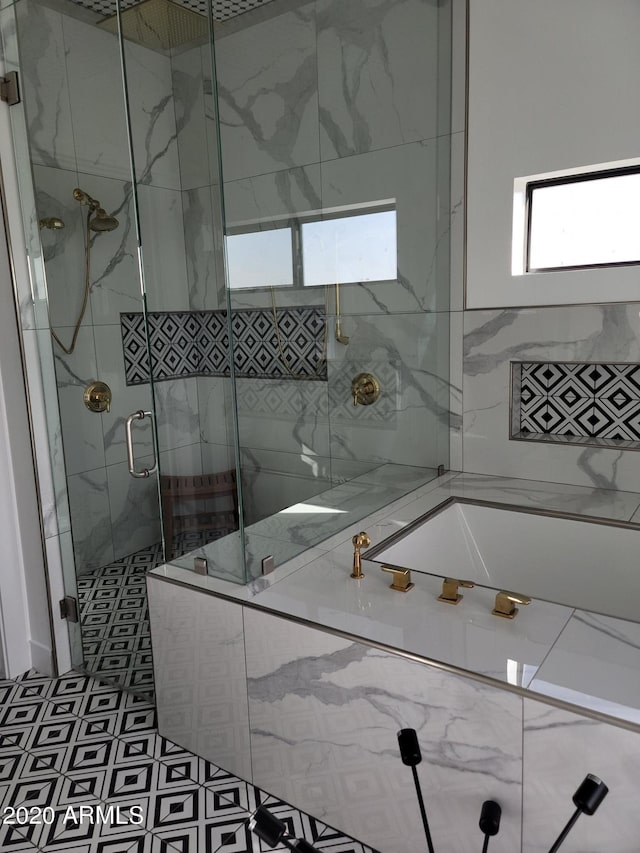 bathroom with tile flooring and plus walk in shower