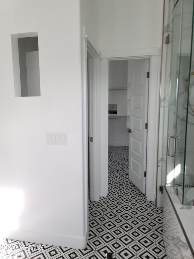 corridor with light tile flooring