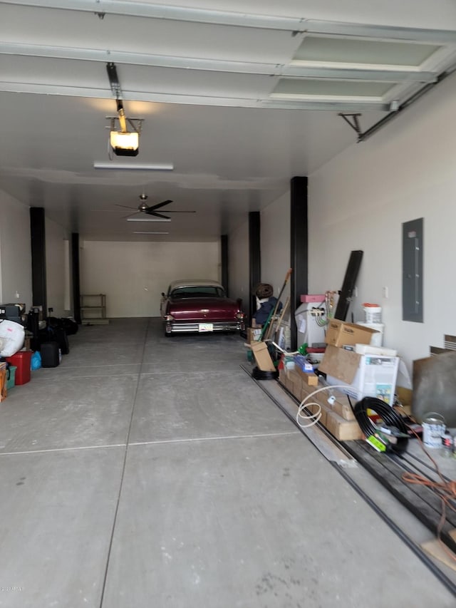 garage with ceiling fan and a garage door opener