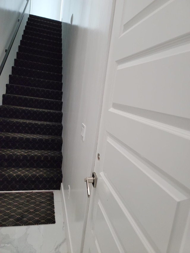 staircase featuring tile flooring