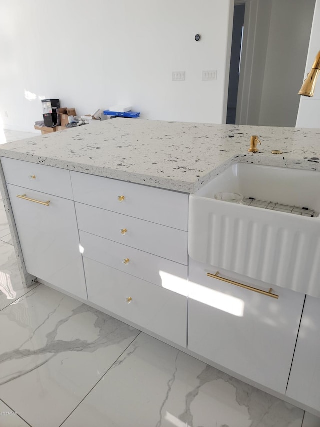 bathroom featuring tile flooring and vanity