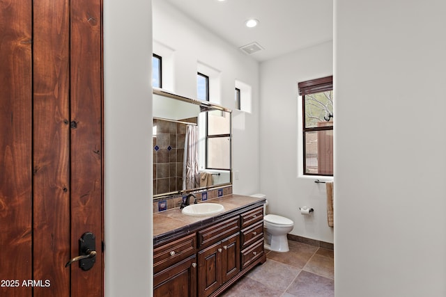 bathroom with recessed lighting, visible vents, toilet, vanity, and baseboards