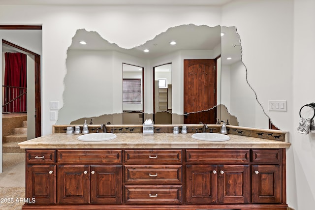 full bathroom featuring a sink and double vanity