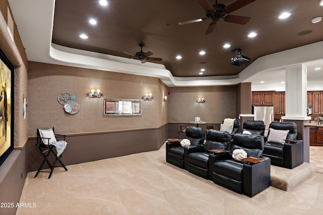 cinema room featuring recessed lighting, a raised ceiling, a ceiling fan, and light colored carpet