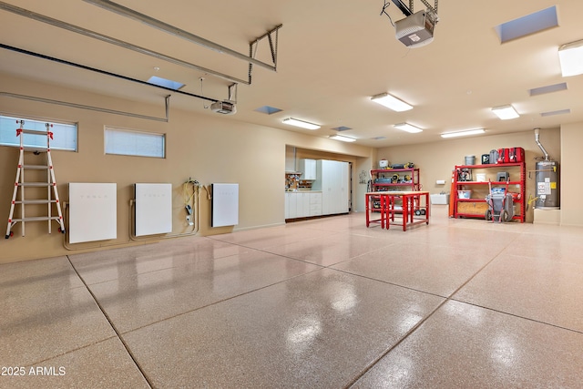 garage featuring secured water heater and a garage door opener