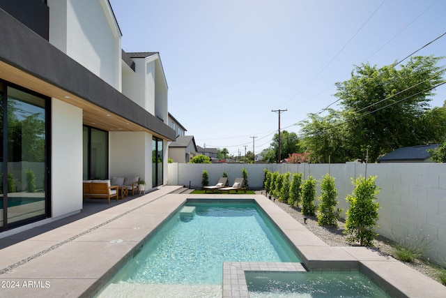 view of swimming pool with a patio area