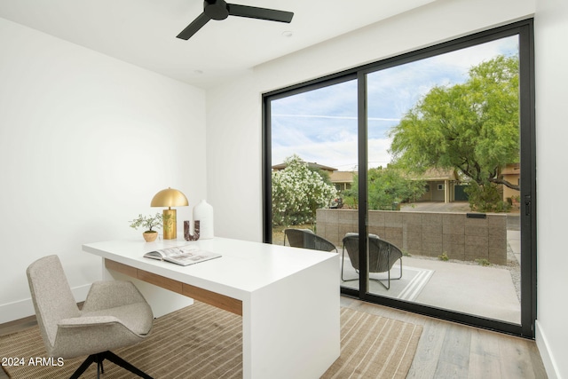 office area with ceiling fan and light hardwood / wood-style flooring