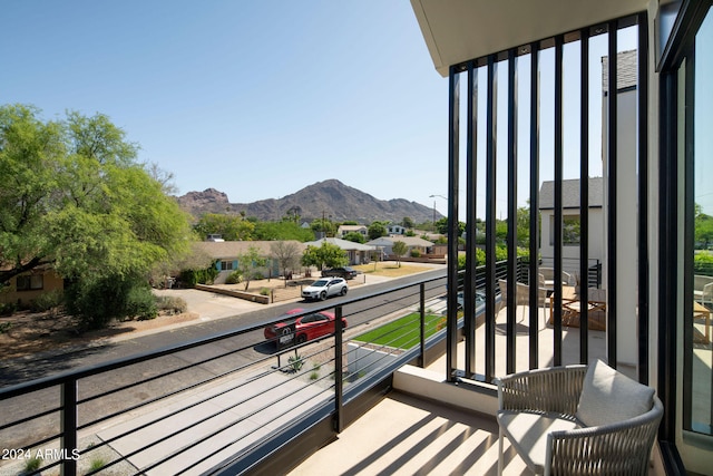 balcony featuring a mountain view