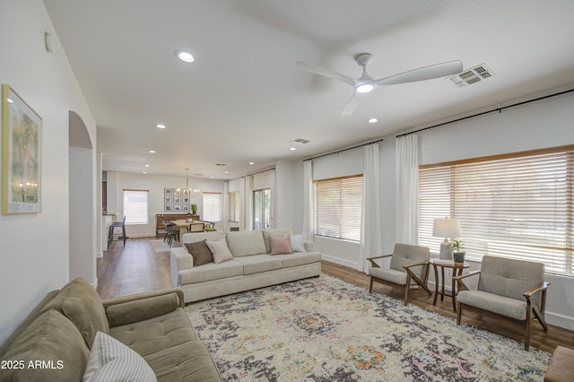 4609 E Ironhorse Rd, Gilbert, AZ 85297 - living room featuring wood finished floors, a ceiling fan, recessed lighting, baseboards, and arched walkways