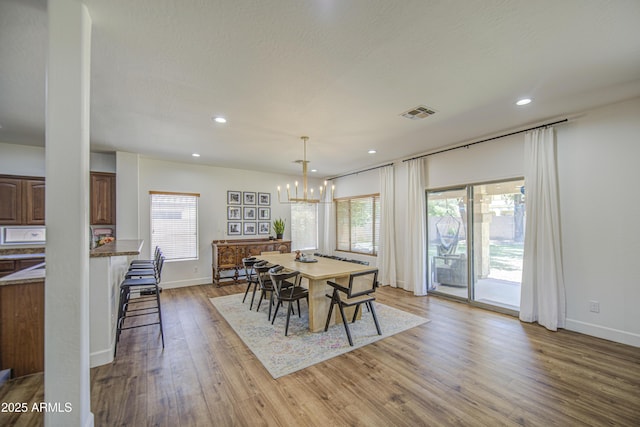 4609 E Ironhorse Rd, Gilbert, AZ 85297 - dining area featuring plenty of natural light, wood finished floors, baseboards, and recessed lighting