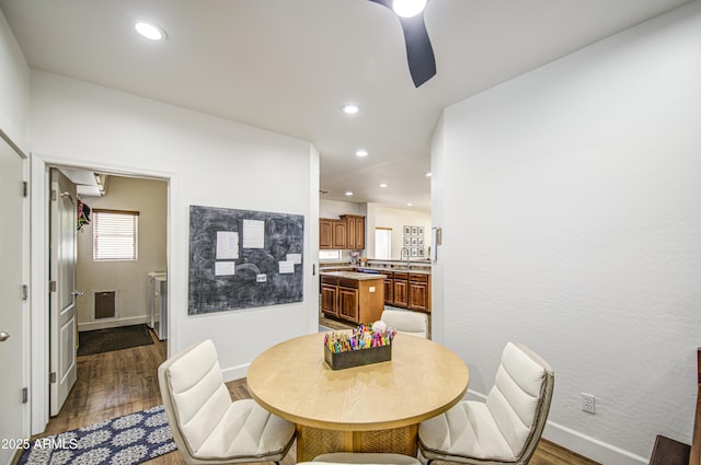 4609 E Ironhorse Rd, Gilbert, AZ 85297 - dining area with dark wood-style floors, baseboards, ceiling fan, and recessed lighting